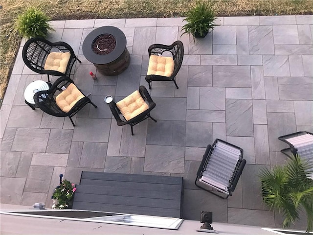 view of patio / terrace with an outdoor fire pit