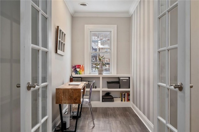 home office featuring french doors, hardwood / wood-style flooring, and crown molding