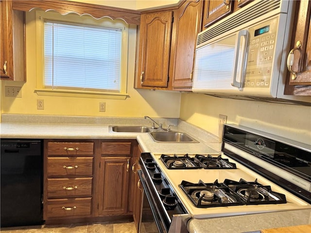 kitchen with white appliances and sink