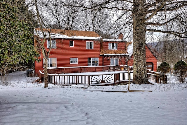 snow covered house with cooling unit