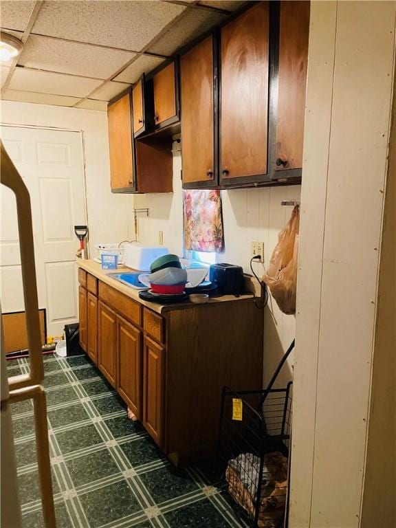 kitchen featuring a paneled ceiling