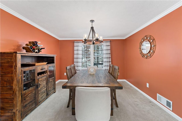 dining space with carpet, crown molding, and an inviting chandelier