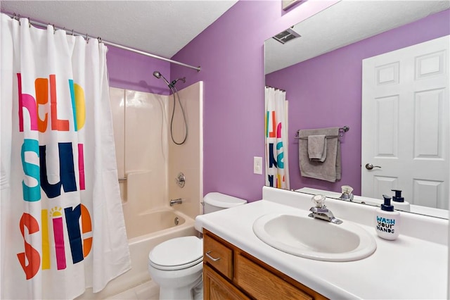 full bathroom featuring vanity, toilet, shower / bathtub combination with curtain, and a textured ceiling