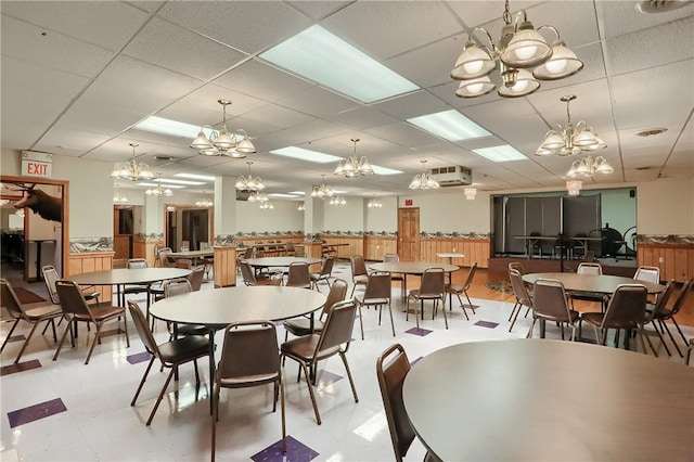 dining room with a drop ceiling