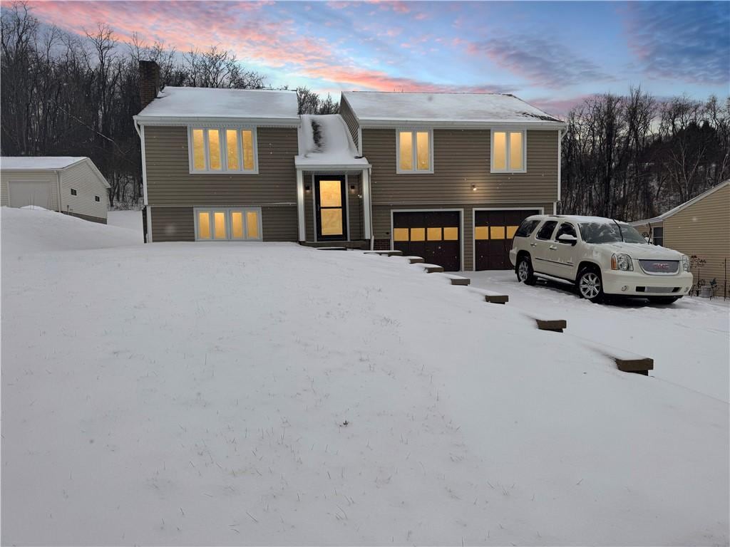 split foyer home featuring a garage