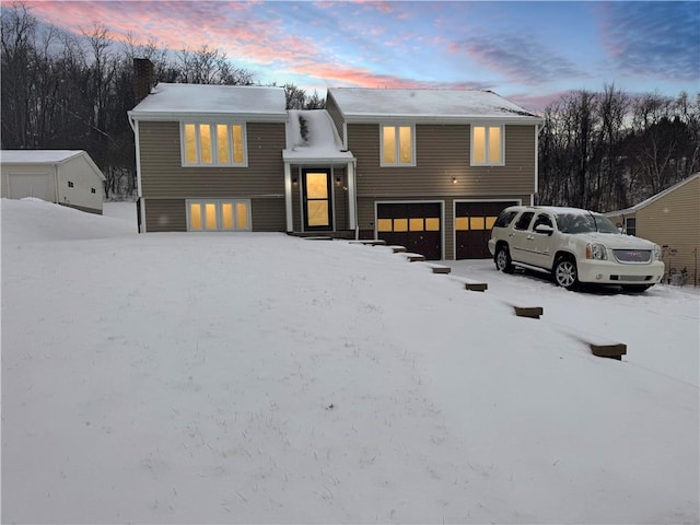 split foyer home featuring a garage