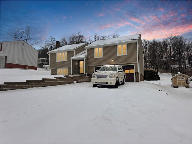 bi-level home featuring a garage