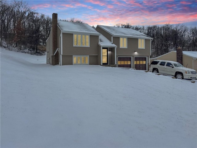 split foyer home featuring a garage