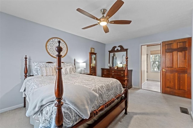 bedroom with light carpet and ceiling fan