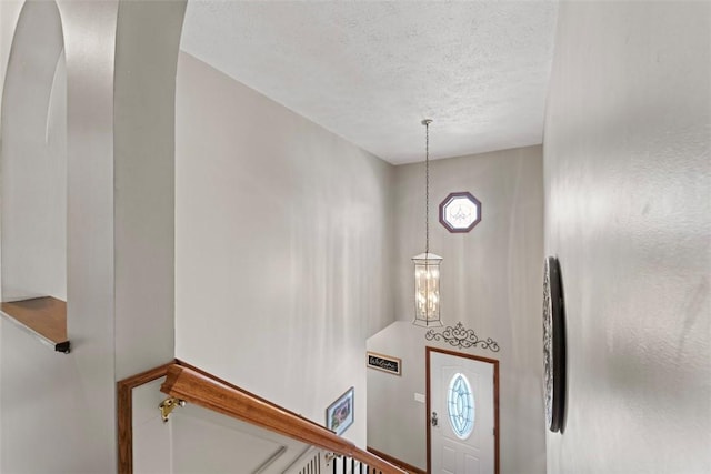 entrance foyer with a textured ceiling