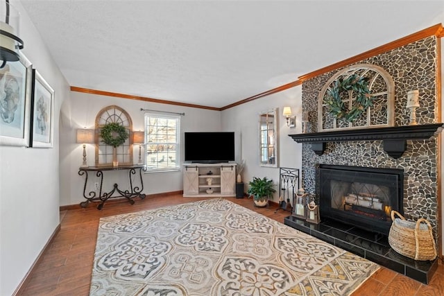 living room featuring hardwood / wood-style floors, ornamental molding, and a tiled fireplace