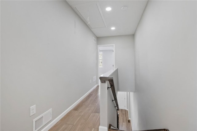 hallway with light hardwood / wood-style flooring