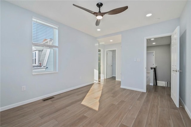 unfurnished bedroom featuring ceiling fan and light hardwood / wood-style floors