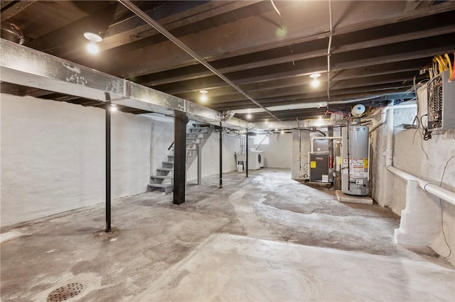 basement with washer / clothes dryer and gas water heater