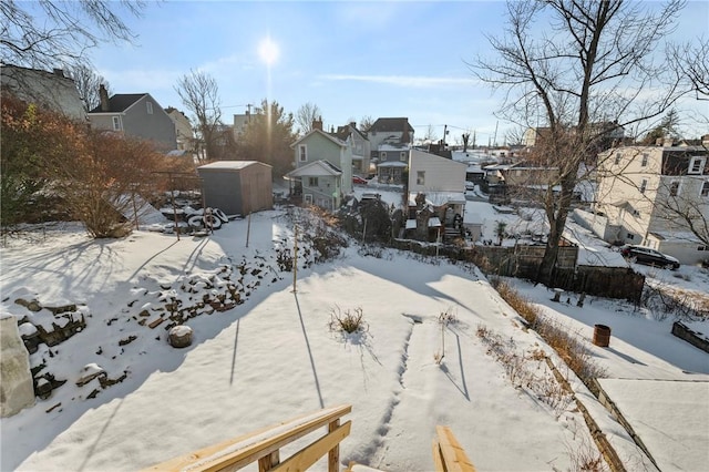 view of yard layered in snow