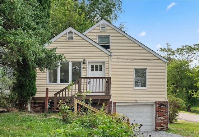 rear view of house with a garage