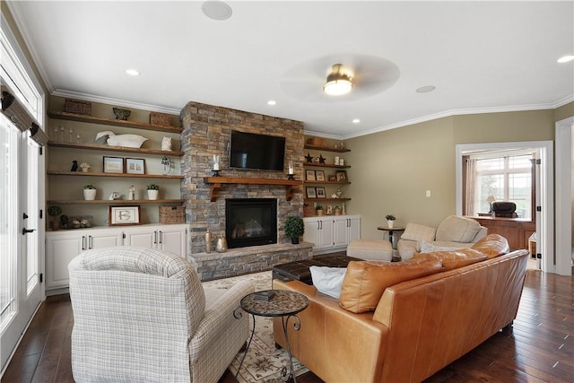 living room featuring a stone fireplace, ceiling fan, dark hardwood / wood-style floors, and ornamental molding