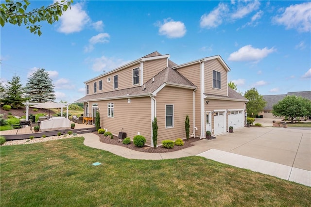 view of side of home with a garage, a lawn, and a wooden deck