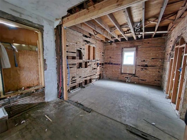 miscellaneous room featuring brick wall