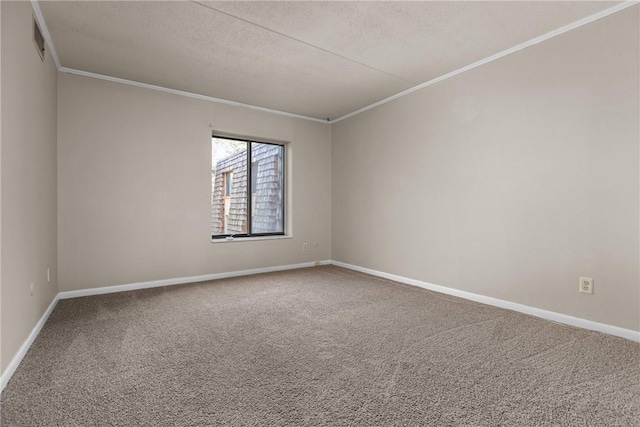 unfurnished room with carpet, a textured ceiling, and ornamental molding