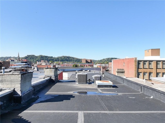 view of parking / parking lot featuring a mountain view