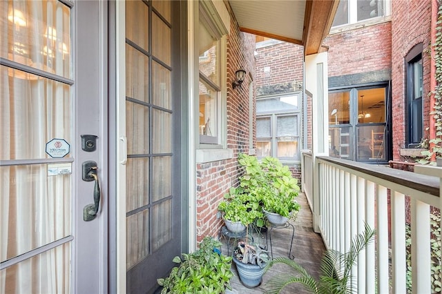 view of exterior entry with covered porch