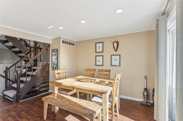 dining area featuring dark hardwood / wood-style floors