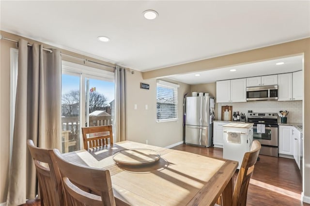 dining space featuring dark hardwood / wood-style floors