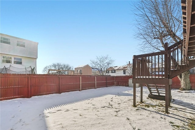 view of yard layered in snow