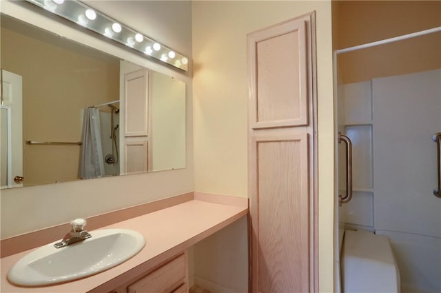 bathroom with vanity and curtained shower