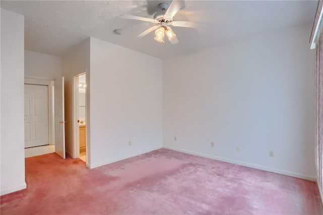 spare room with carpet flooring, a textured ceiling, and ceiling fan