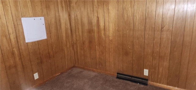 empty room with dark colored carpet