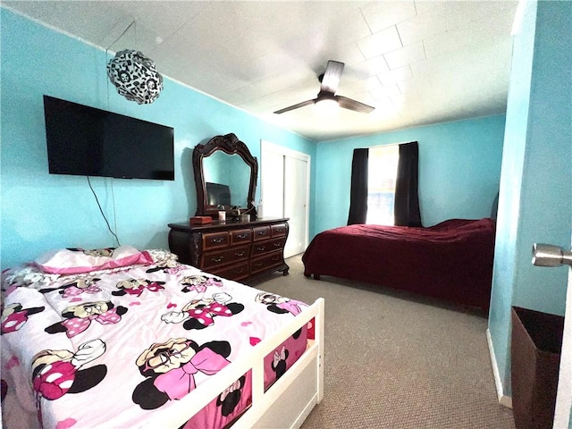 carpeted bedroom with ceiling fan