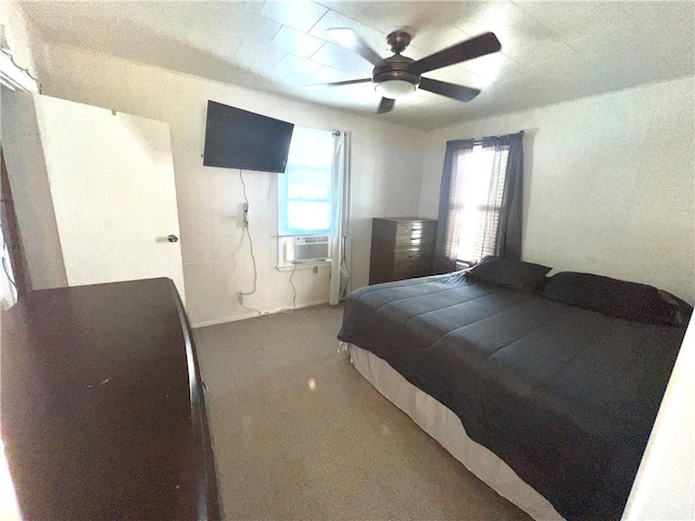 bedroom with ceiling fan, dark carpet, and cooling unit