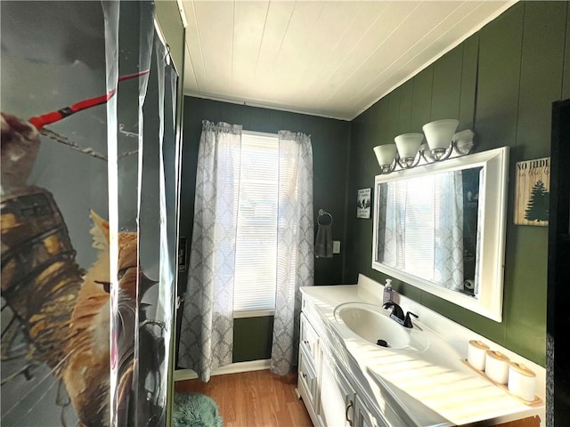 bathroom with vanity, hardwood / wood-style flooring, and wooden ceiling