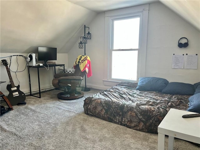 bedroom with carpet flooring and vaulted ceiling