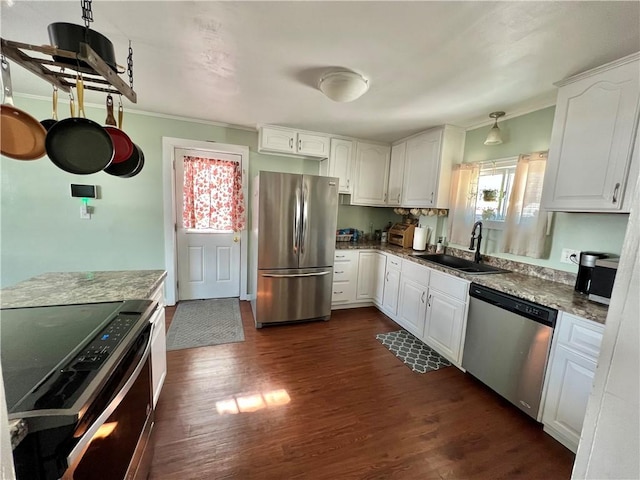 kitchen featuring appliances with stainless steel finishes, dark hardwood / wood-style flooring, sink, stone counters, and white cabinetry