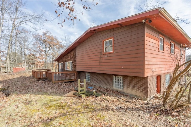 view of side of property with a deck