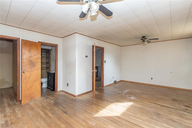 spare room with light hardwood / wood-style flooring and ceiling fan