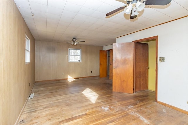 unfurnished room with light hardwood / wood-style floors and ceiling fan