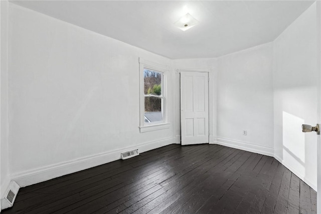 empty room featuring dark hardwood / wood-style floors