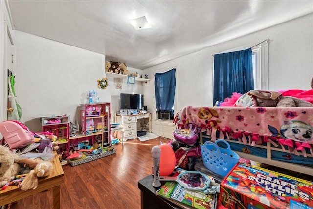 bedroom with hardwood / wood-style floors