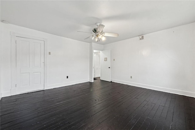 spare room with ceiling fan and dark wood-type flooring