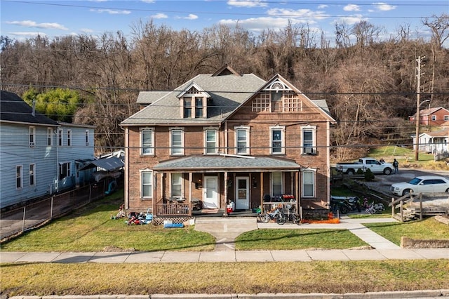 view of front of property with a front lawn and a porch