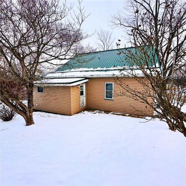 view of snow covered house