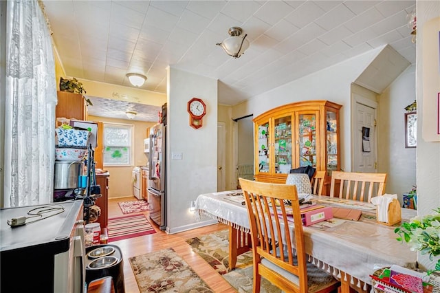 dining space featuring light hardwood / wood-style flooring