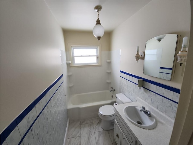 full bathroom with shower / bathtub combination, vanity, tile walls, and toilet