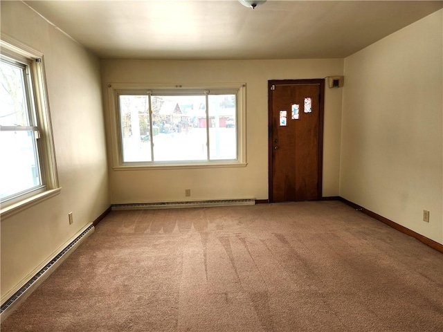 carpeted foyer featuring a baseboard radiator