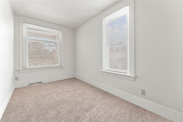 unfurnished room with carpet floors