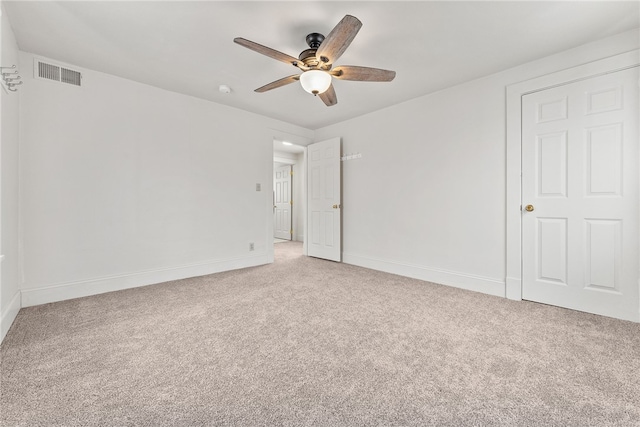 unfurnished room with ceiling fan and carpet floors